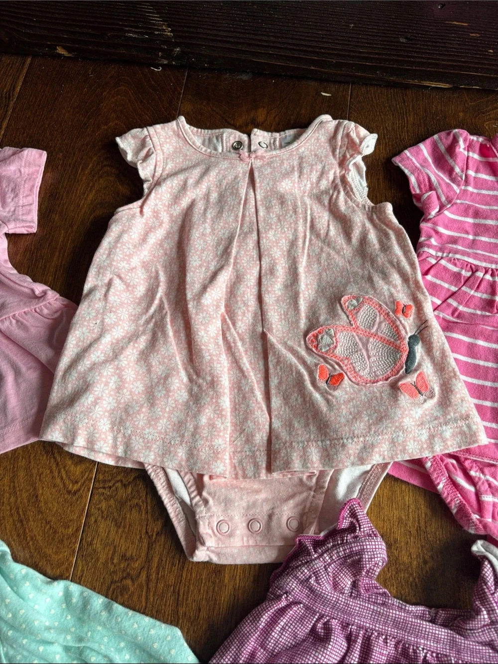 6 tops and 3 rompers with various designs